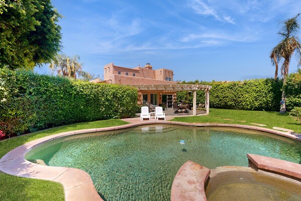 A heated pool - Expansive home with fireplace, heated pool & and spa in backyard haven (Indio)