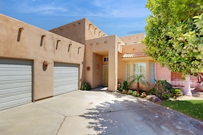 Exterior - Expansive home with fireplace, heated pool & and spa in backyard haven (Indio)