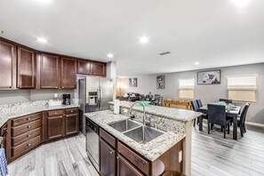 Fridge, microwave, oven, stovetop - Modern home near lake with private pool, fenced yard & W/D - dog-friendly (Indio)