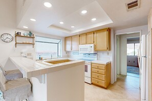 Fridge, microwave, oven, stovetop - Elegant Palm Desert Resort Condo with Mountain Views, Pool & Spa (Palm Desert)