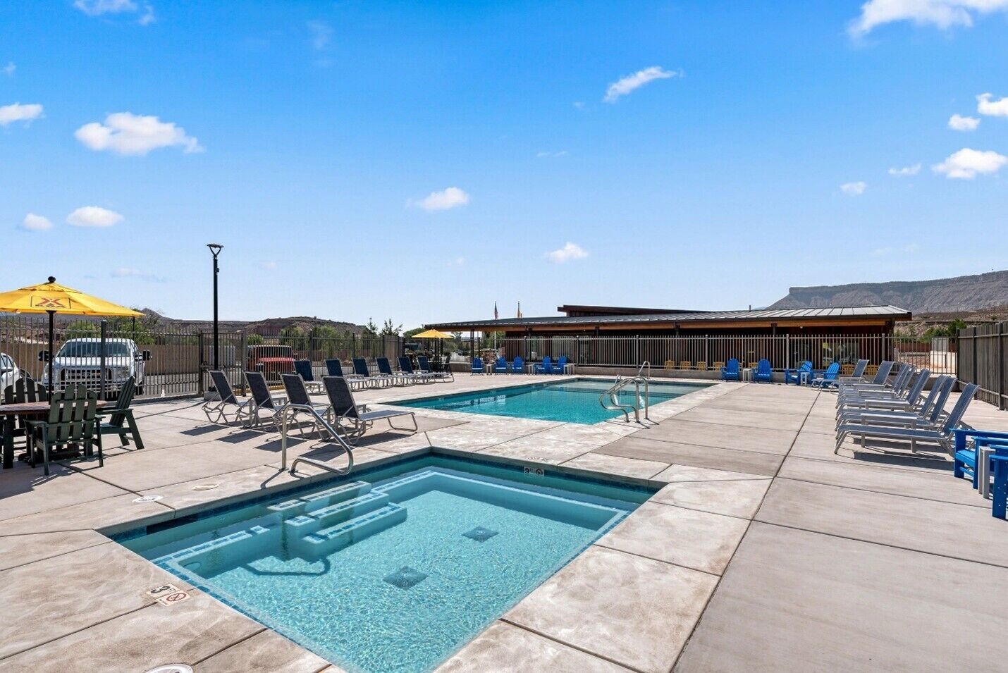 Seasonal outdoor pool, open 10:00 AM to 8:00 PM, pool umbrellas