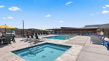 Seasonal outdoor pool, open 10:00 AM to 8:00 PM, pool umbrellas
