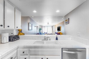 Fridge, microwave, oven, stovetop - Comfortable, dog-friendly condo in a gated community w/ a shared pool (Rancho Mirage)
