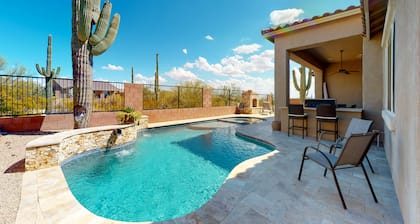 Southwestern stunner with enclosed yard, pool, putting green, & grill