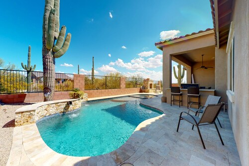 Southwestern stunner with enclosed yard, pool, putting green, & grill