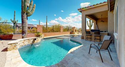 Southwestern stunner with enclosed yard, pool, putting green, & grill