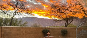 Dog-friendly desert home with mountain views, enclosed yard, grill, W/D, and AC