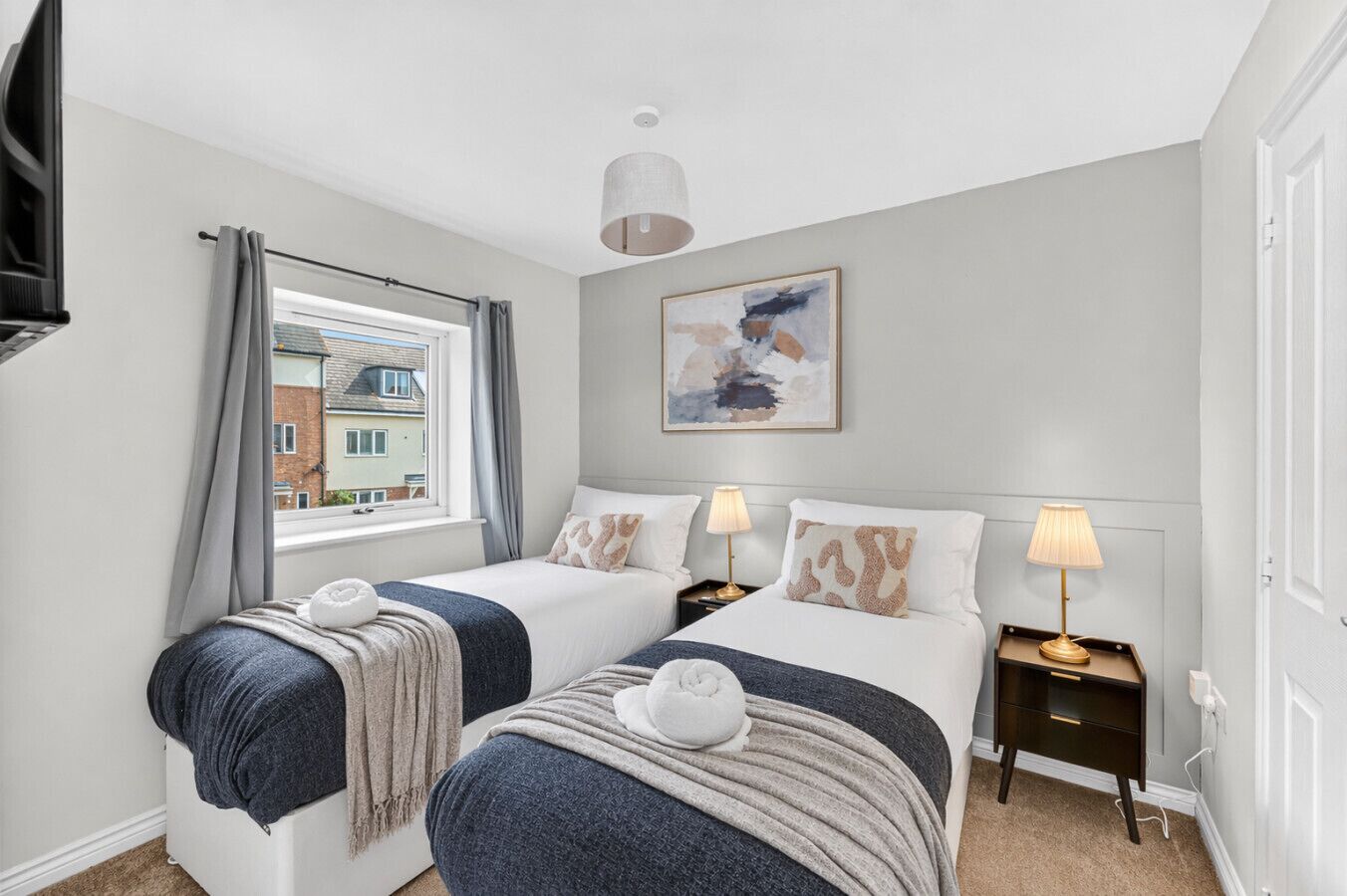 The master bedroom features a comfortable zip-and-link bed, arranged as two single beds by default, with the option to convert it into a king upon request.