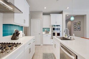 Fridge, microwave, oven, stovetop - Modern home with gas fireplace, mountain views, large yard (Cathedral City)