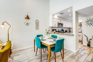 A modern kitchen with white cabinets, a microwave, and a sink. - Beautifully updated mid-century condo with shared pool/spa & mountain views (Palm Springs)