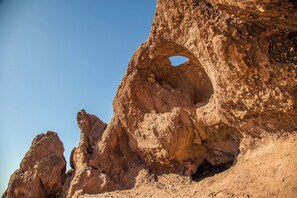 A natural rock formation with a prominent arch. - Dog-friendly home w/outdoor pool & firepit, near the top of South Mountain - Desert Foothills (Phoenix)
