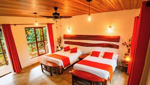 A room with two beds, wooden headboard, red curtains, and a large window with a view of greenery. - Superior Room 1 or 2 beds Suchipakari Jungle Lodge (Napo)