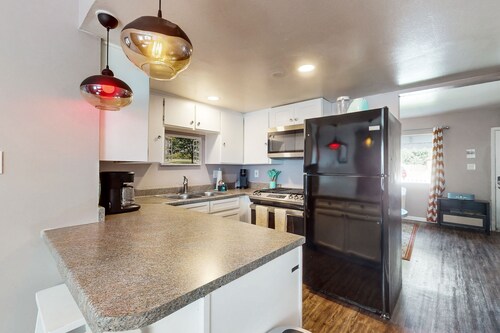 Dog-friendly condo near attractions with fenced yard, central AC, and cute decor