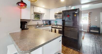 Dog-friendly condo near attractions with fenced yard, central AC, and cute decor