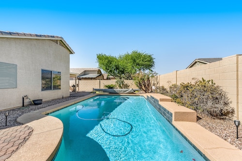 Spacious home with private heated pool with waterfall, putting green & firepit