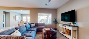 Single-story home with enclosed yard, private pool, hot tub, patio, & grill