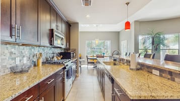 Coffee/tea maker, fridge, microwave, oven