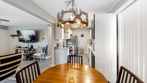 A modern kitchen with white cabinets, a built-in oven, and a stainless steel refrigerator. - Snowbird-friendly home with central AC, washer/dryer & free WiFi - near golf (Phoenix)