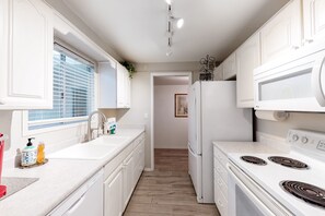 Fridge, microwave, oven, stovetop - Dog-Friendly Home near Downtown with Private Patio, Gas Grill, Central A/C, W/D (Sun City)