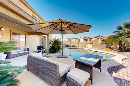 Spacious home surrounded by palms with pool, grill, children's items, & W/D