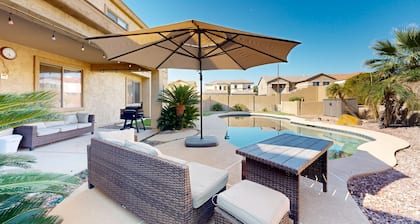 Spacious home surrounded by palms with pool, grill, children's items, & W/D
