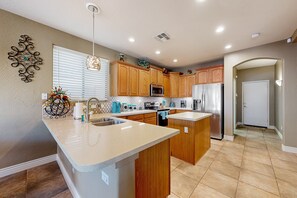 Fridge, microwave, oven, stovetop - Spacious home surrounded by palms with pool, grill, children's items, & W/D (Litchfield Park)