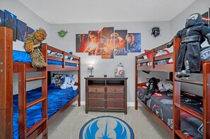 A bunk bed room with Star Wars themed decorations, including posters and a rug. - Modern 6BR Villa / Games Room/ Private Pool & Spa/10 Min to Disney (Kissimmee)