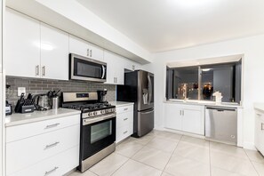 Comfort Room, Patio, Garden View | Private kitchen | Coffee/tea maker, electric kettle - Lakefront Villa ·Tropical Backyard·Kayak·Cool Deck  (North Miami Beach)