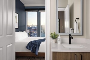 The Courier Corner Suite | Bathroom | Hair dryer, bathrobes, towels, soap