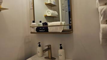 Hair dryer, towels, soap, toilet paper