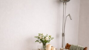 A dining table with a white tablecloth, wooden chairs, and a vase with flowers. - RARE Paris XV- ideal location 🏠 House with large courtyard (Paris)