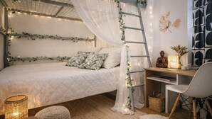A cozy bedroom with a bed, a desk, and a ladder. - RARE Paris XV- ideal location 🏠 House with large courtyard (Paris)