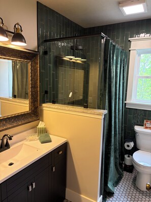Shower, hair dryer, towels, soap