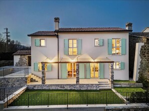 A two-story house with stone accents, a covered porch, and a stone staircase leading to the entrance. - Vacation home Amore near Motovun, Istria (Sovišćina)