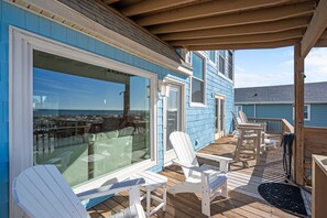 Outdoor dining - Rest a Shored: Spacious 4BR oceanfront retreat in Oak Island, NC, perfect for families! (Oak Island)