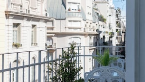 A row of white buildings with balconies and a white railing in the foreground. - Leonardo Da Vinci Aparts by MOT Rentals (Buenos Aires)
