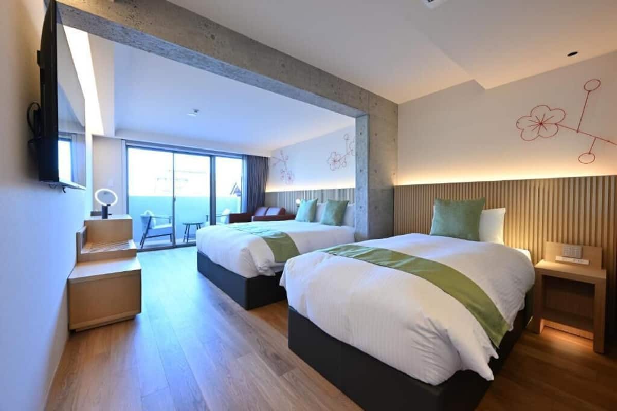 Deluxe Quadruple Room, Balcony | In-room safe, desk, blackout curtains, iron/ironing board