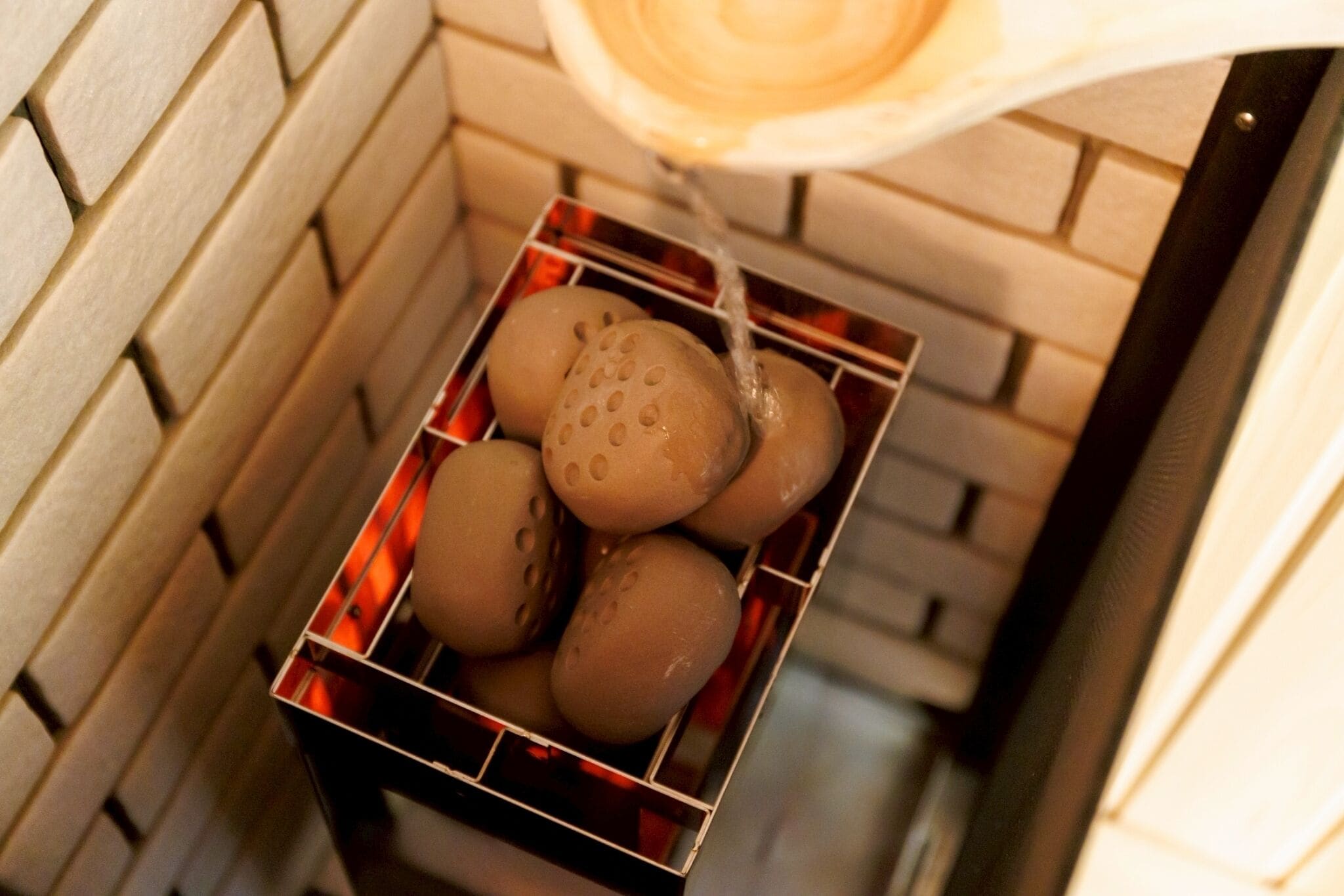 A box of bread with a water dispenser above it.