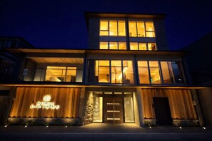 A two-story building with large windows, a wooden facade, and a sign reading 'KIYOMIZU ELITE TERRACE.' - Kiyomizu Elite Terrace (Kyoto)