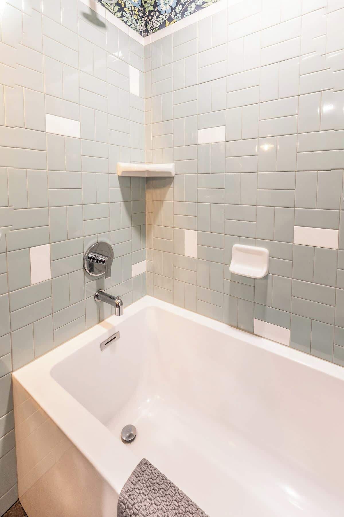 A bathroom with a bathtub, a shower, and a toilet.