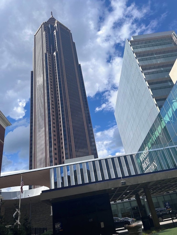 A modern building with a tall, rectangular structure and a glass facade.