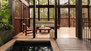 A wooden deck with a seating area, a small pool, and a view of the surrounding greenery. - Boca De Agua Bacalar (Felipe Carrillo Puerto)