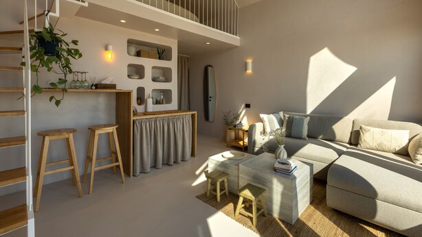 A modern living room with a sofa, coffee table, and a staircase. - Oasis Village (Eforie)