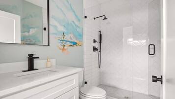 Shower, hair dryer, towels, shampoo