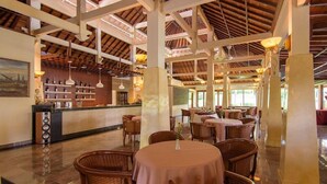 A spacious indoor area with high ceilings, wooden beams, and multiple tables and chairs. - Champlung Sari Villa & Spa (Ubud)