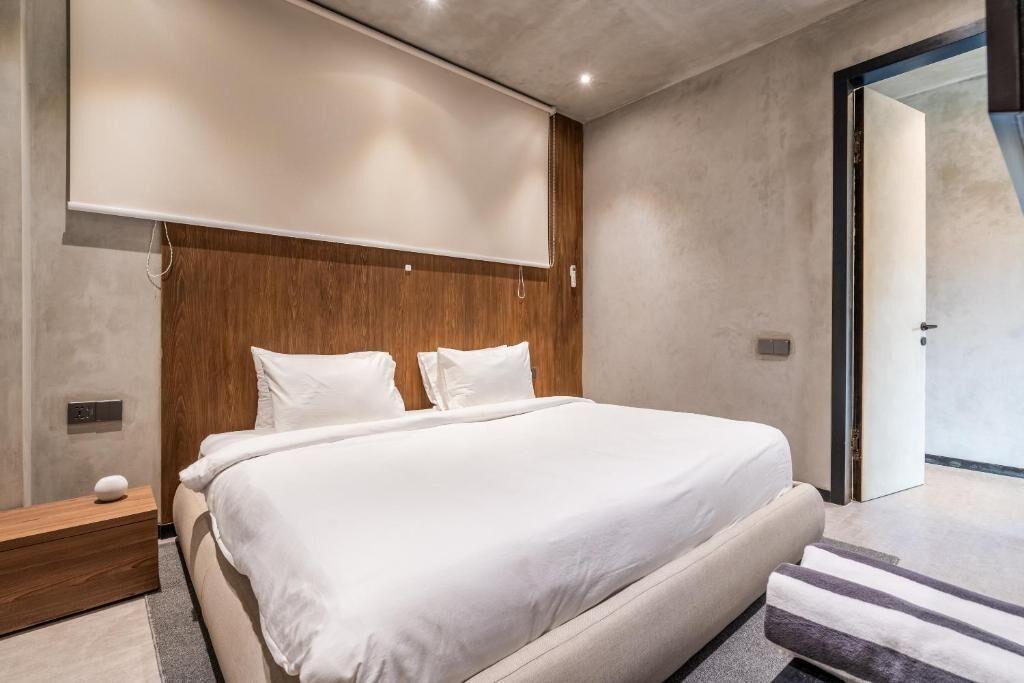 Appartement Deluxe, balcon | Coffres-forts dans les chambres, rideaux occultants