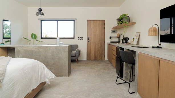 A modern, compact living space with a bed, kitchenette, and a dining area. - Loft 2 min walk from the Marina CSL (Cabo San Lucas)