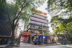 A multi-story building with a prominent sign for "The Prime Banquet" on the ground floor.