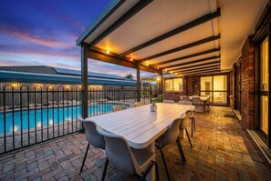 Outdoor dining - Room for Everyone, Spacious 4BR Pool Retreat (Kirwan)