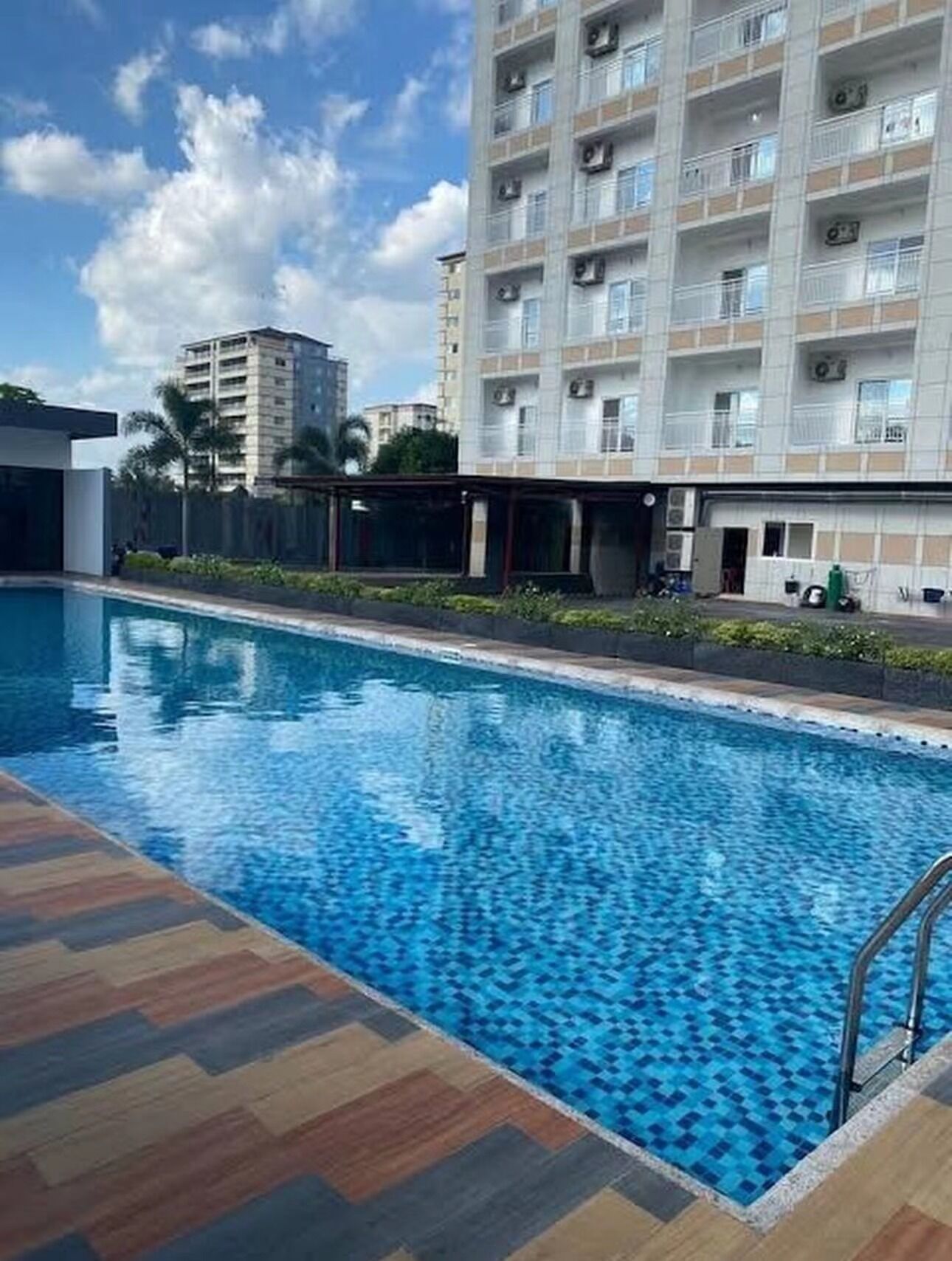 Outdoor pool, open 8:00 AM to 8:00 PM, pool umbrellas